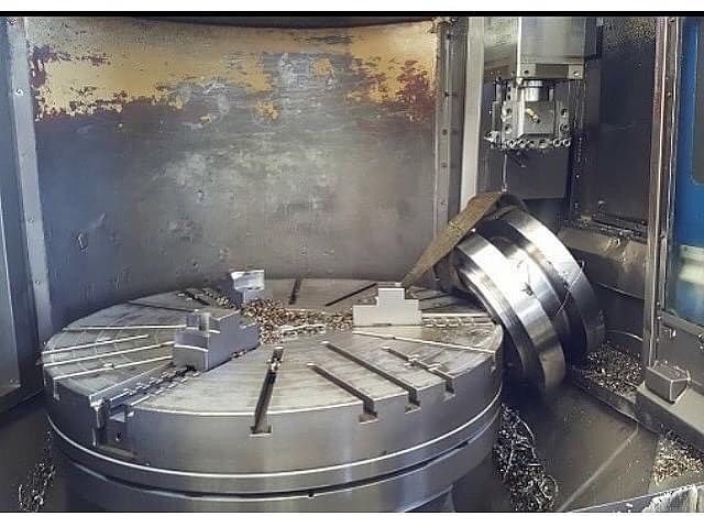 a large metal machine with many pieces of metal