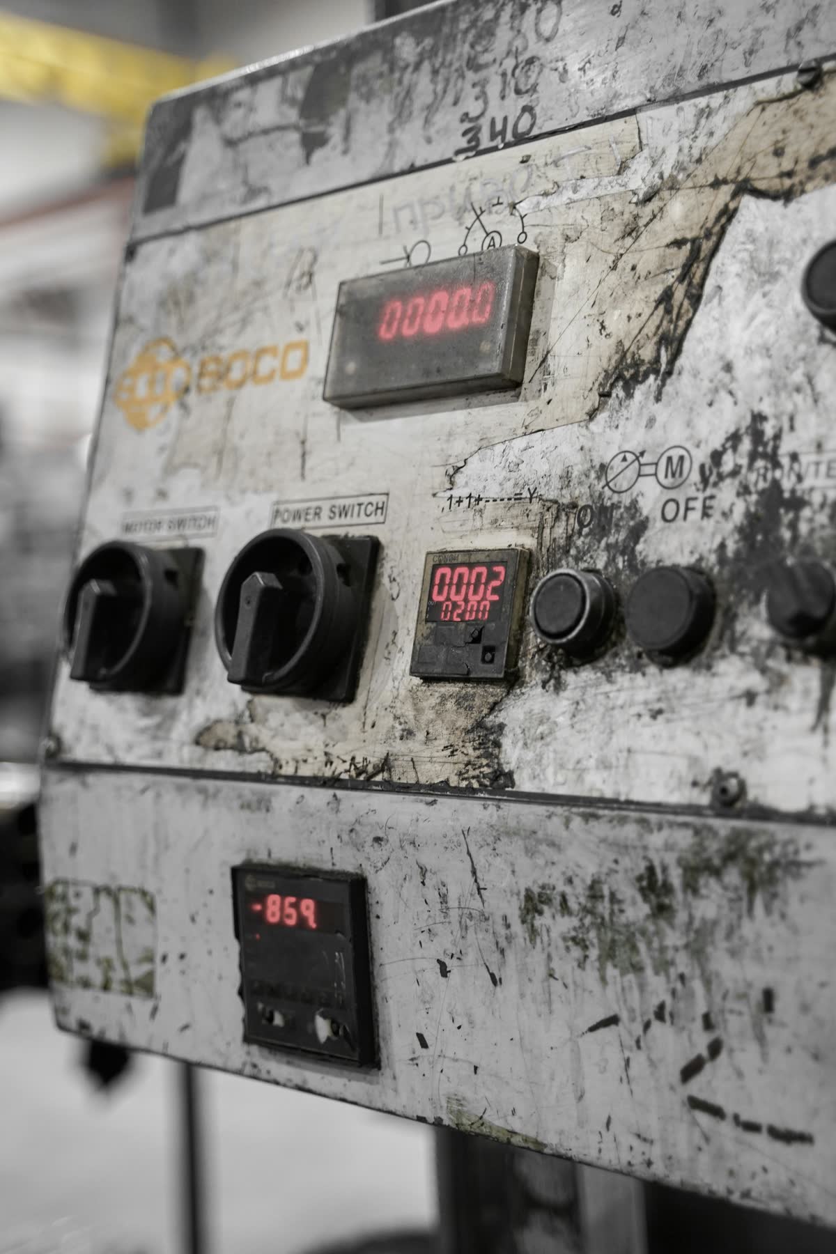 ABB AC500 PLC Critical Vulnerability — aged industrial control panel showing unpatched manufacturing equipment risk